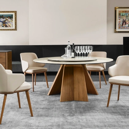 Tavolo rotondo con piano in ceramica e basamento in legno Icaro di Calligaris